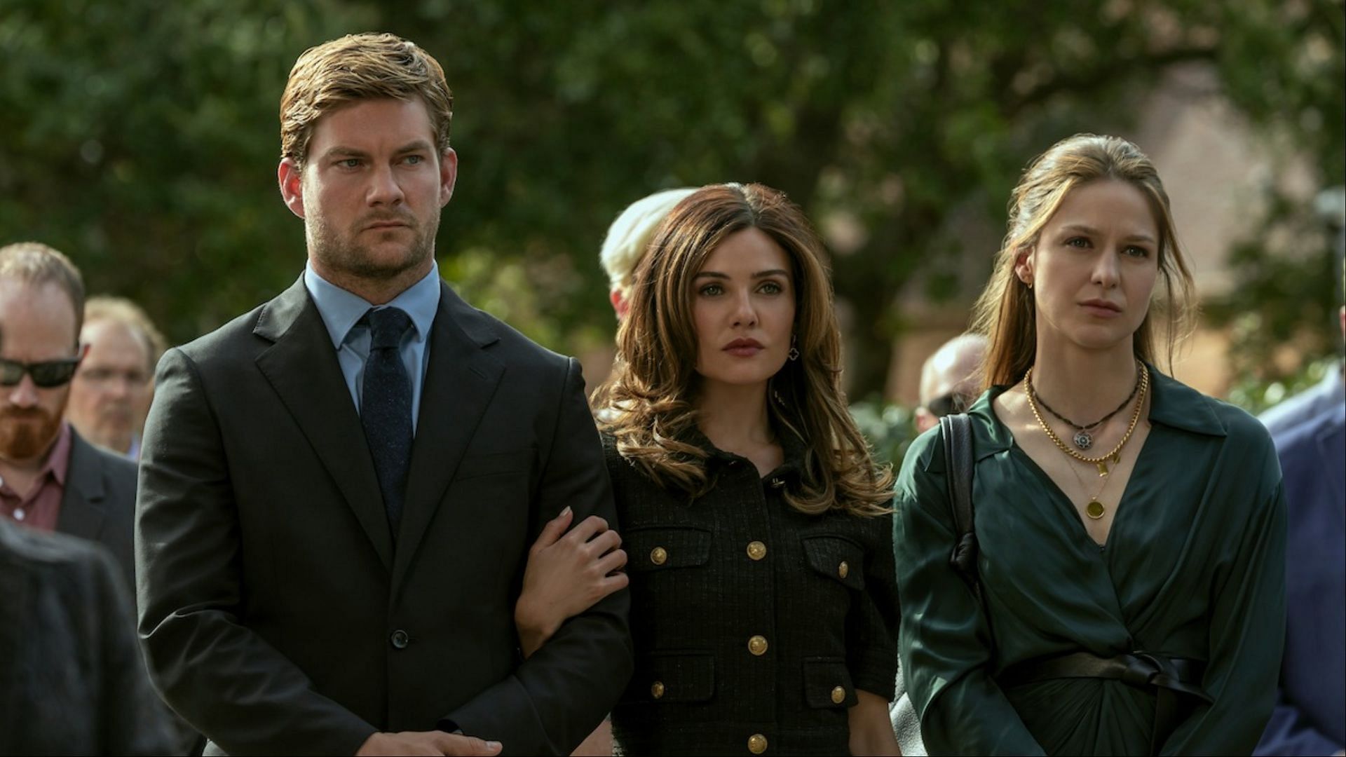 A rare united front: Cane, Peyton, and Bree Buckley appear at a funeral in The Waterfront as their family's empire begins to unravel. (Image via Netflix)
